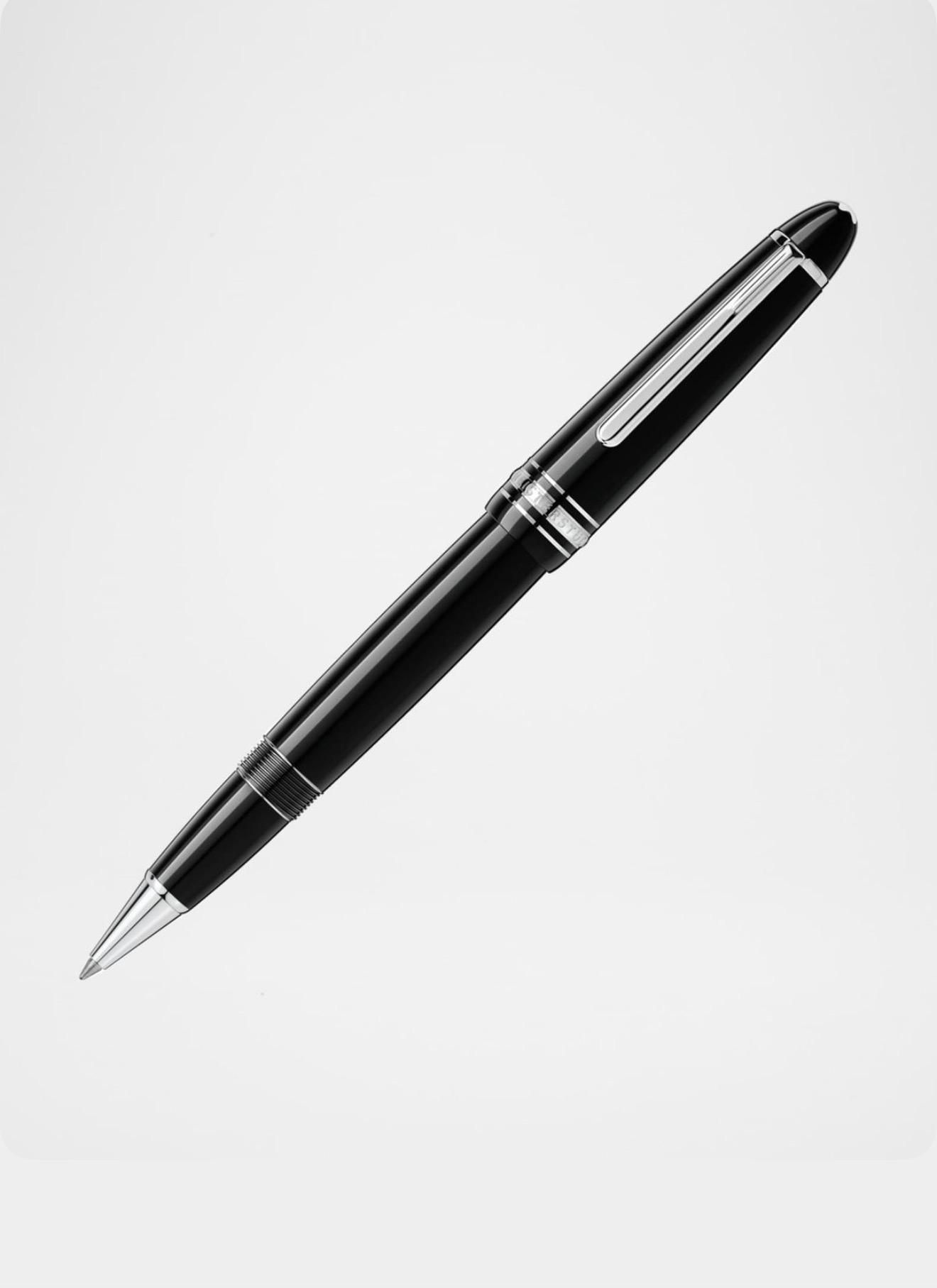 Black fountain pen resting on a white surface