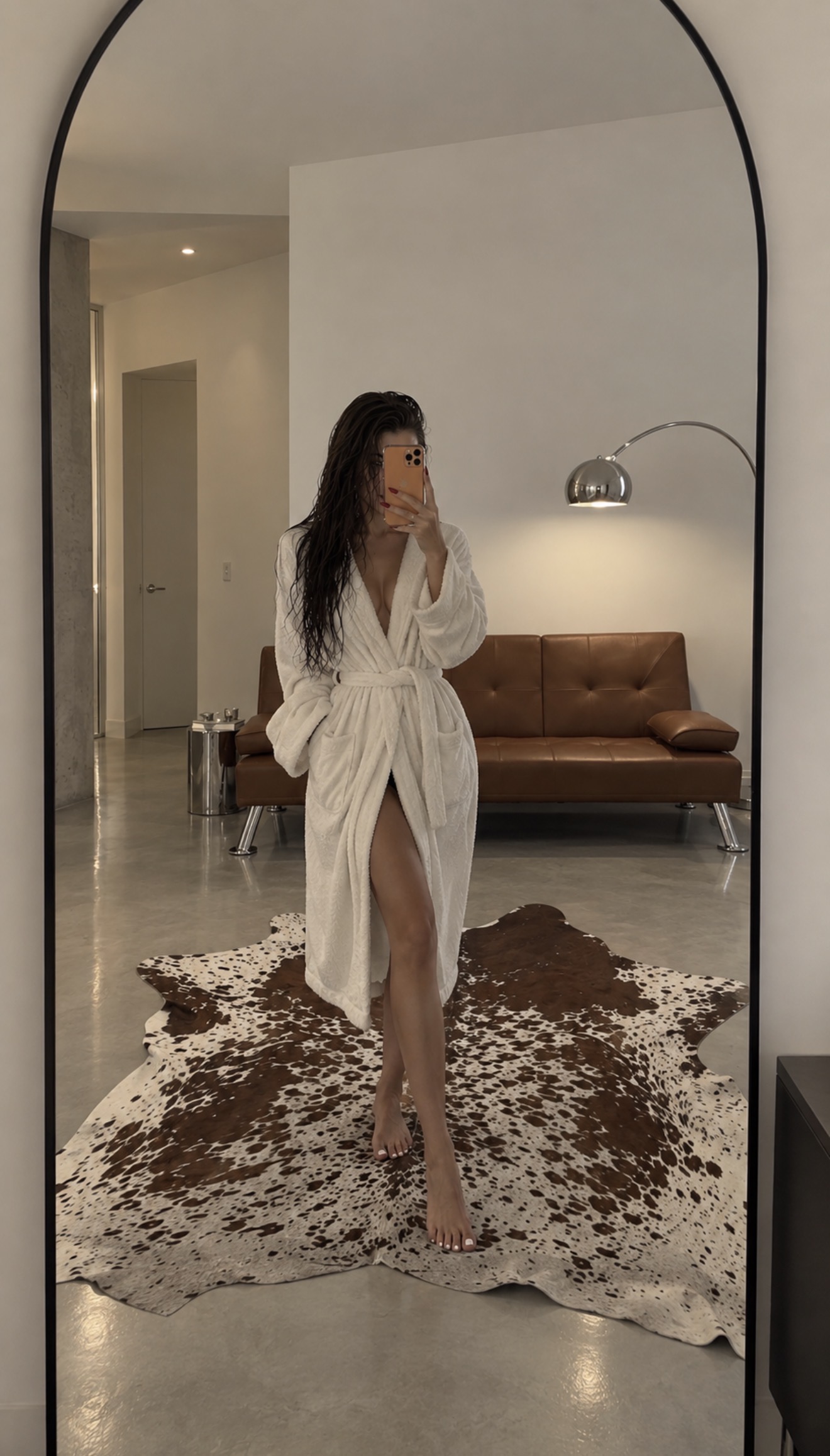 COOL GIRL HOME ESSENTIALS — Celebrity-inspired interiors without the celebrity price tag. Shop the mirror, cowhide rug, bathrobe, and sofa to recrea